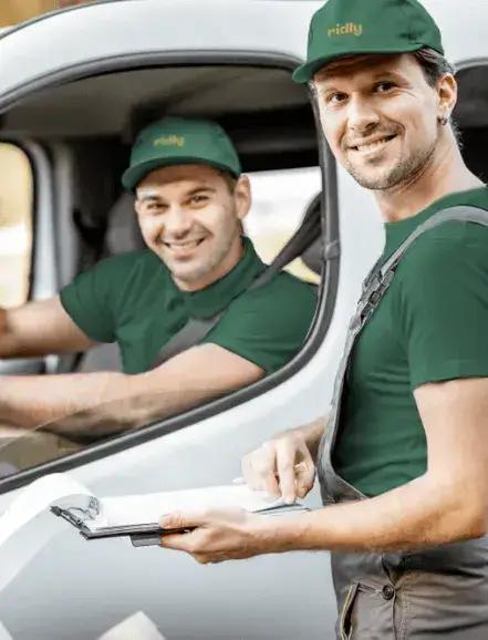 two Ridly rubbish removalist in front of a truck
